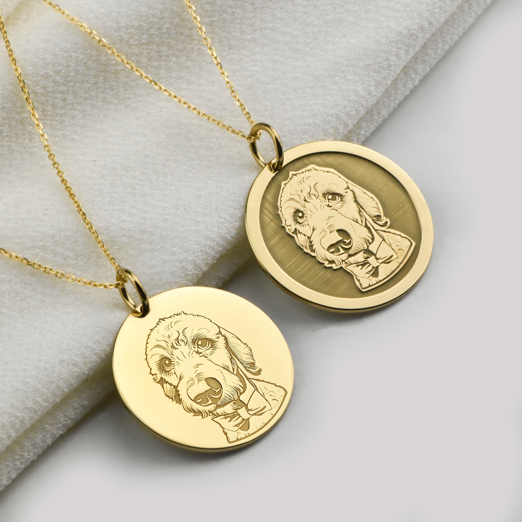 An image of our two styles of pendants that we offer, the simple engraving option and a raised engraving option.